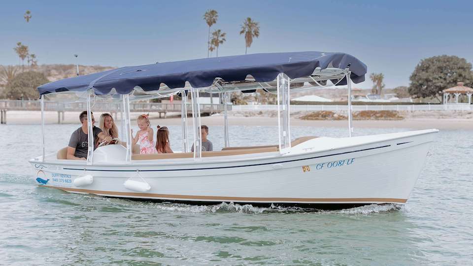 family enjoying duffy boat