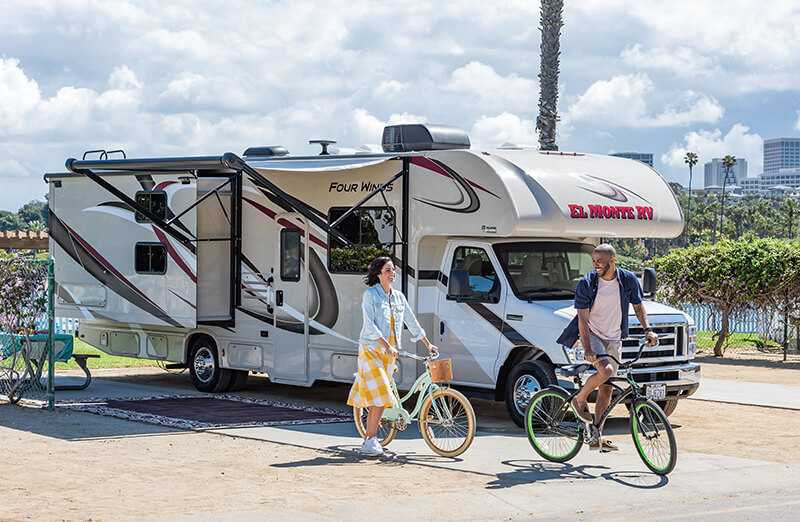 couple with bikes at Newport Dunes RV site
