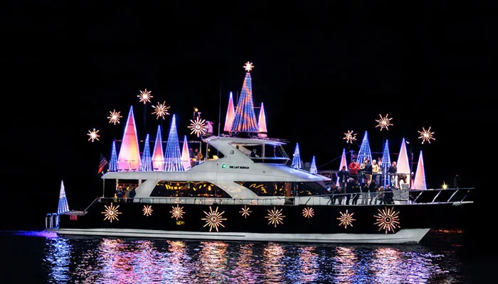 boat lit with holiday lights in Newport Harbor