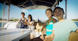 family enjoying a cruise on a electric Duffy boat at Newport Dunes Resort