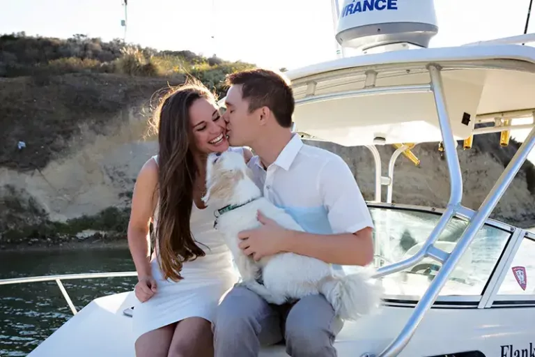 Wedding couple on bow of boat